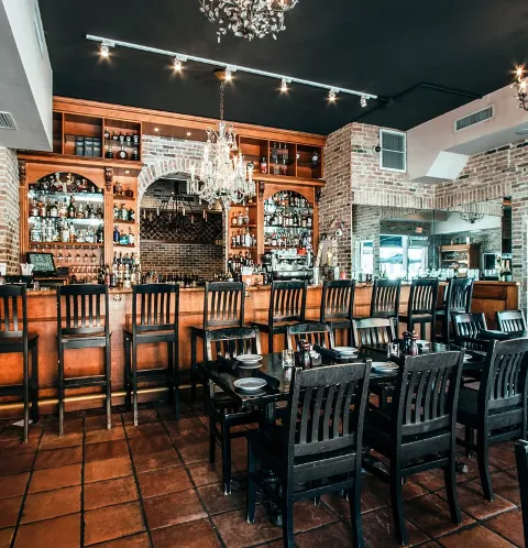 Elegant bar and dining area at Boheme Bistro with stylish decor and cozy ambiance.