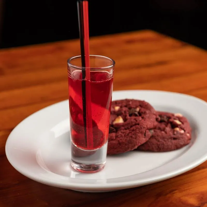 Jello shot served on a plate with cookies