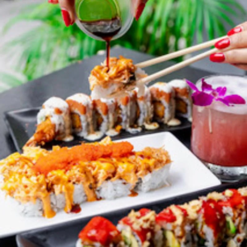 Hands and served food.