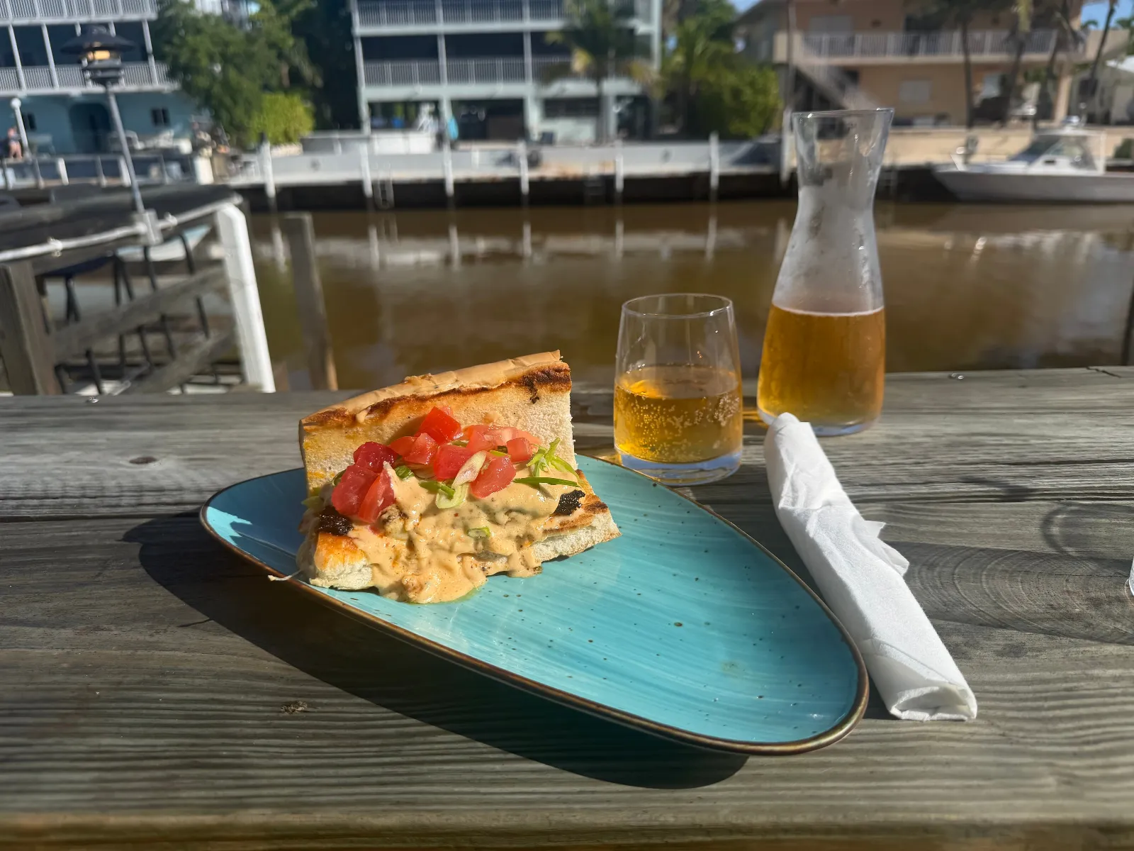 Hot Tin Roof sandwich with wine carafe on the waterfront deck