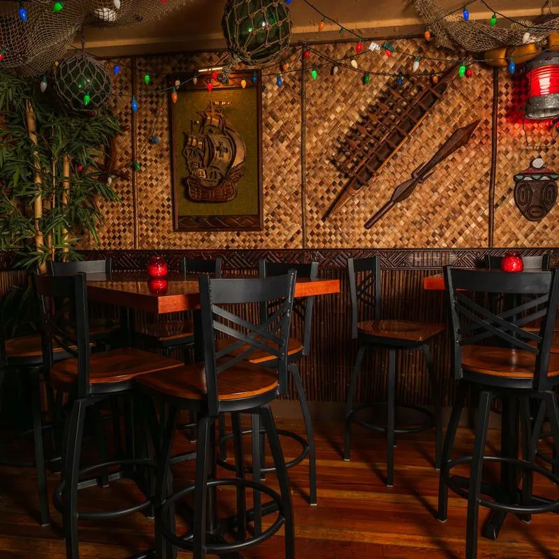 Kapakele Rum Bar, seating area in a tiki bar setting.