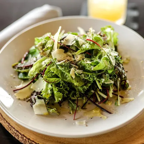 Mixed greens salad with cheese.