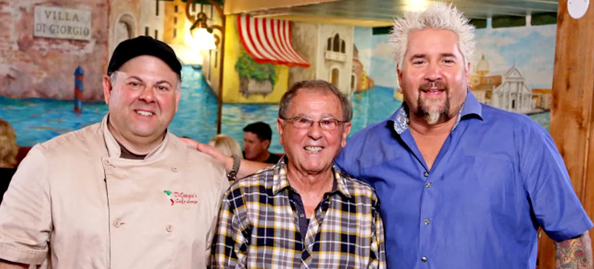 guy fieri with the chefs and owners of cafe largo