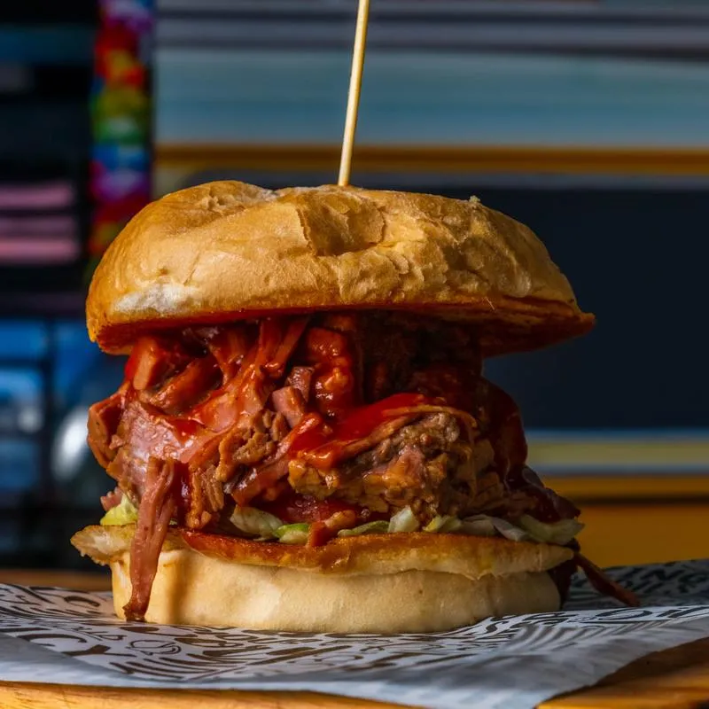Brisket sandwich with lettuce, tomato, and mayo on toasty bread.