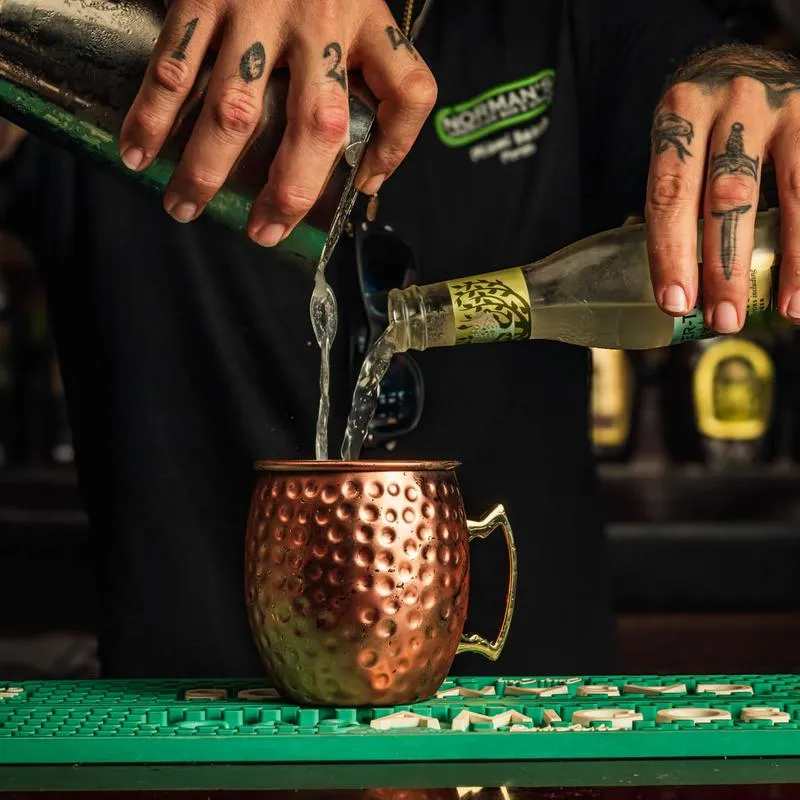 A bartender making a cocktail.