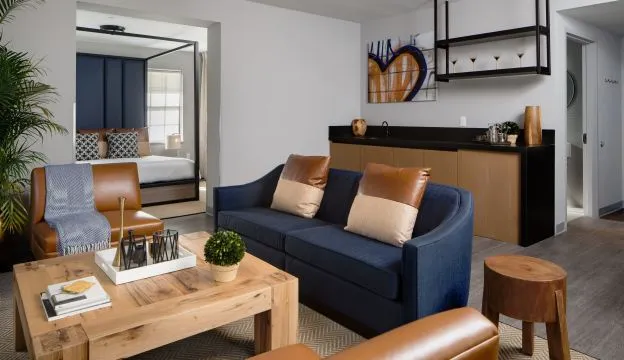 A Living Room With A Blue Couch