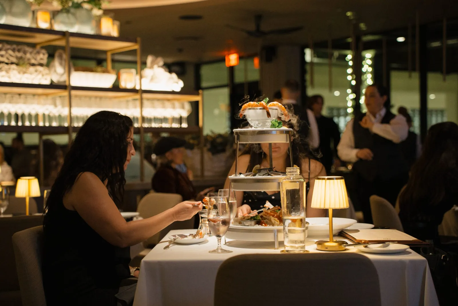 Smoking Shellfish Tower with guest at table