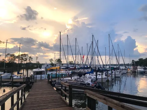 Bluewater Bay Marina dock overlooking boats at sunset