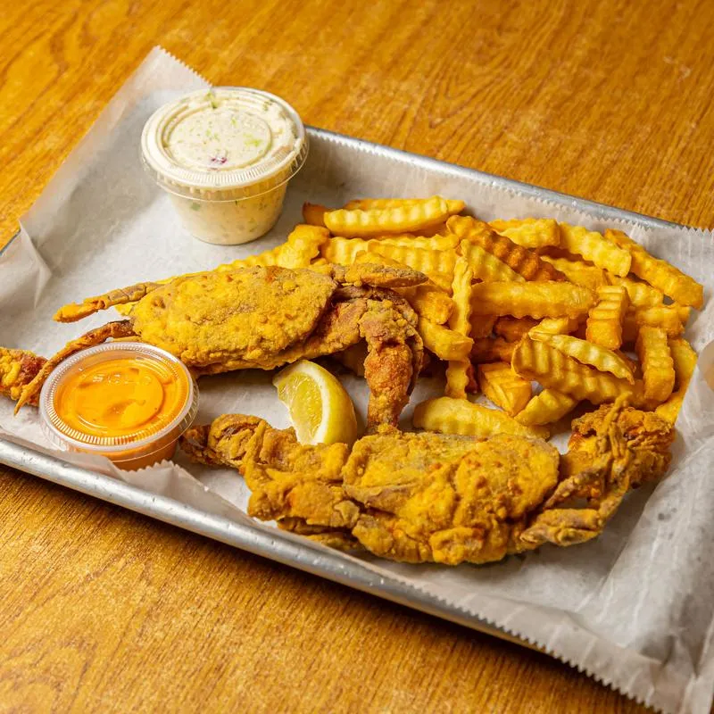 Fried soft shell crab served with crinkle fries and dipping sauces.