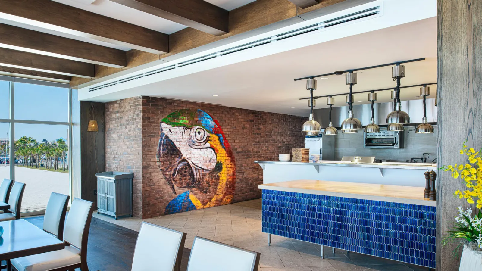 A Large Kitchen With A Large Stone Fireplace