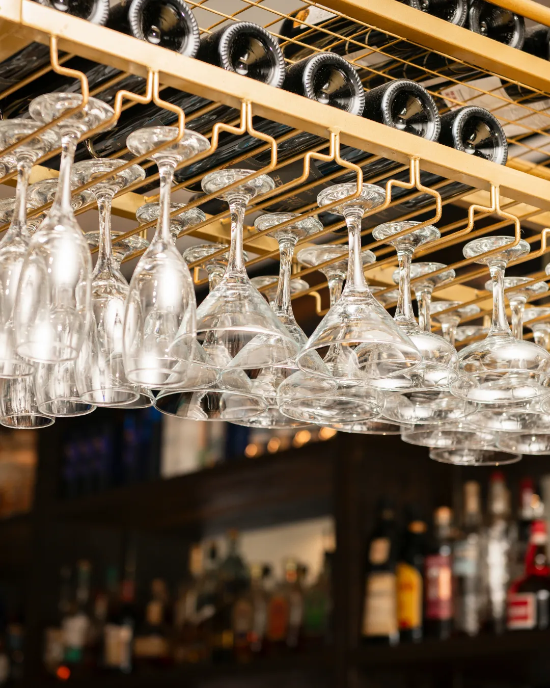 Acropolis_Kennedy_GoldRack_HangingWineGlasses