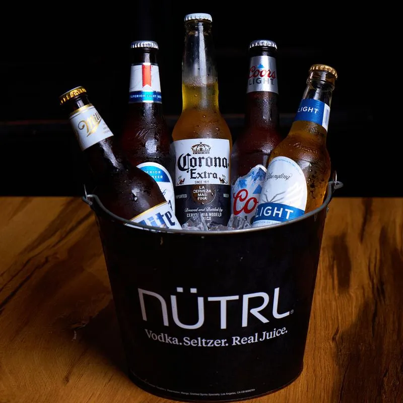 Ice bucket with bottled beers.