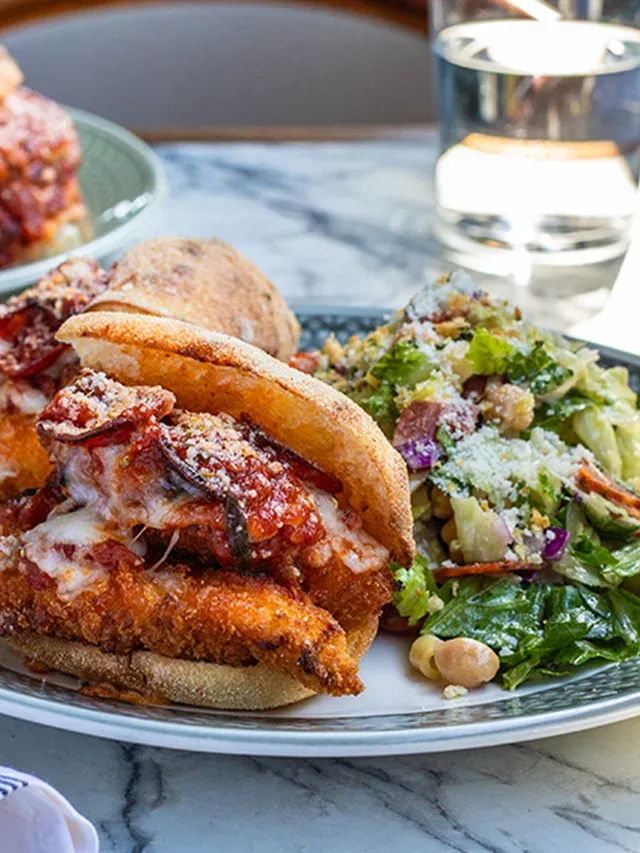 Image of Piccolo Buco Sandwich and Half Salad on a Table