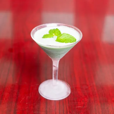 Grasshopper drink served in martini glass.