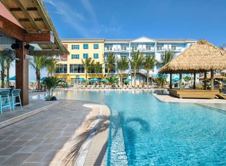 A Pool With A Building In The Background