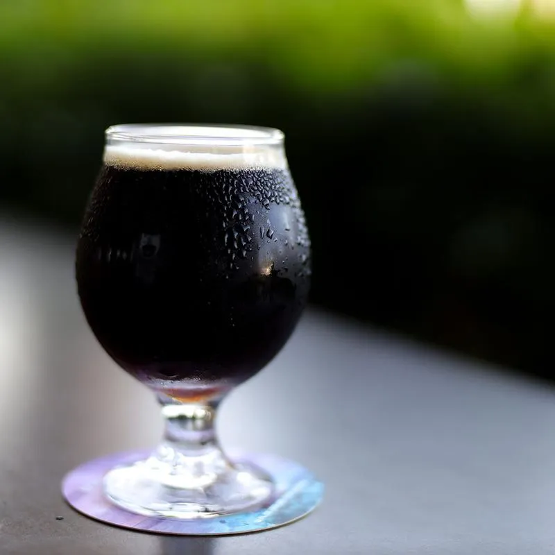 A glass of dark beer
