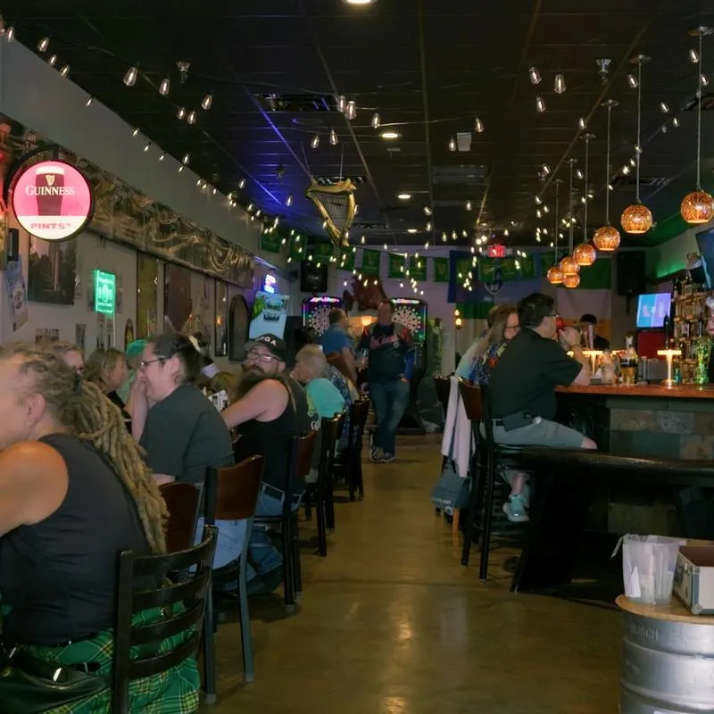 Interior with people siting at the tables and at the bar.