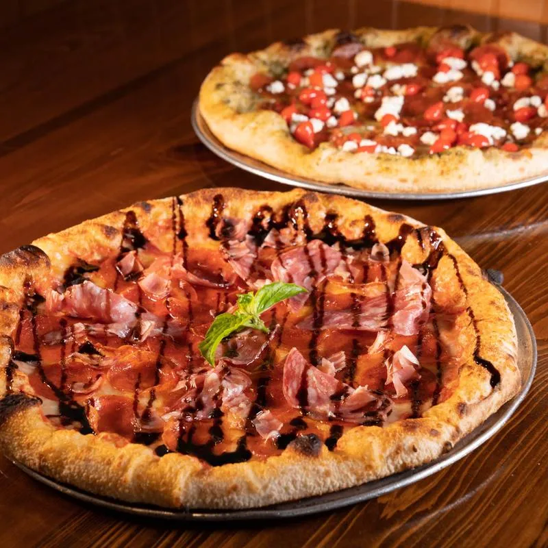 Pepperoni, salami, and prosciutto pizza, with mozzarella, tomato sauce and balsamic.