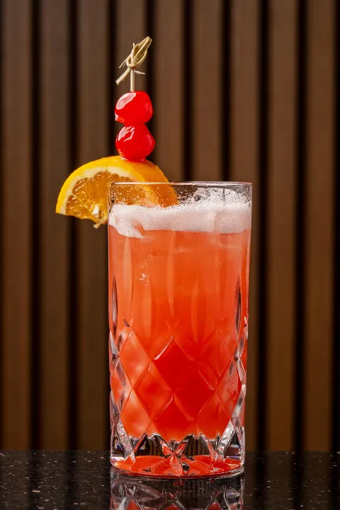 A vibrant, refreshing craft cocktail served in a glass