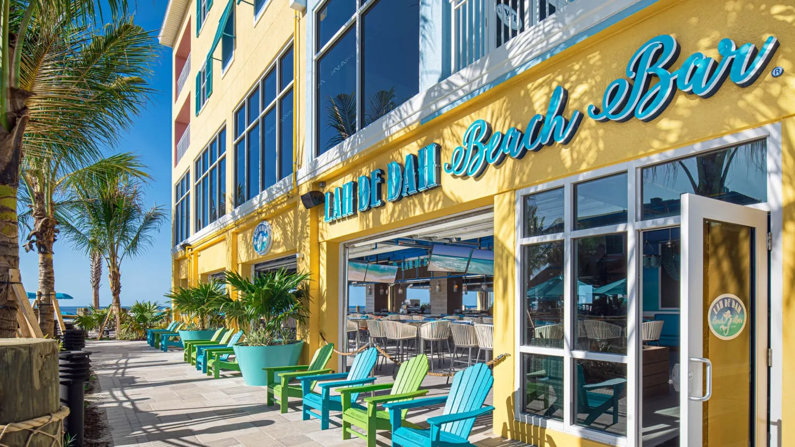 A Building With Tables And Chairs Outside