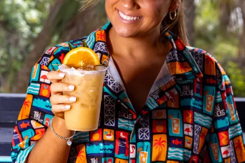 Bartender serving tropical drink