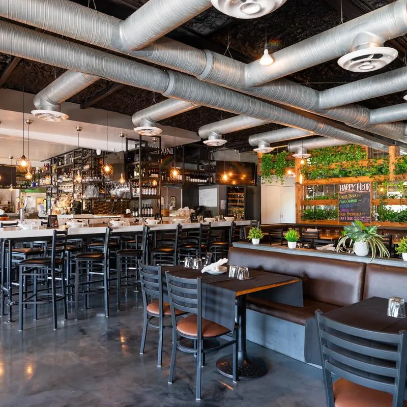 The serving counter, stools, tables and chairs.