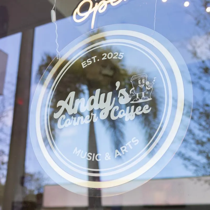 Cafe window signage with a name and a