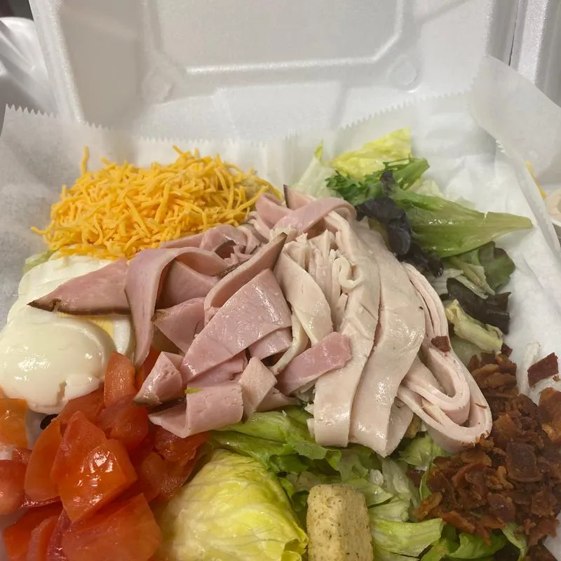 Smoked meat, mixed vegetables and dip on the side