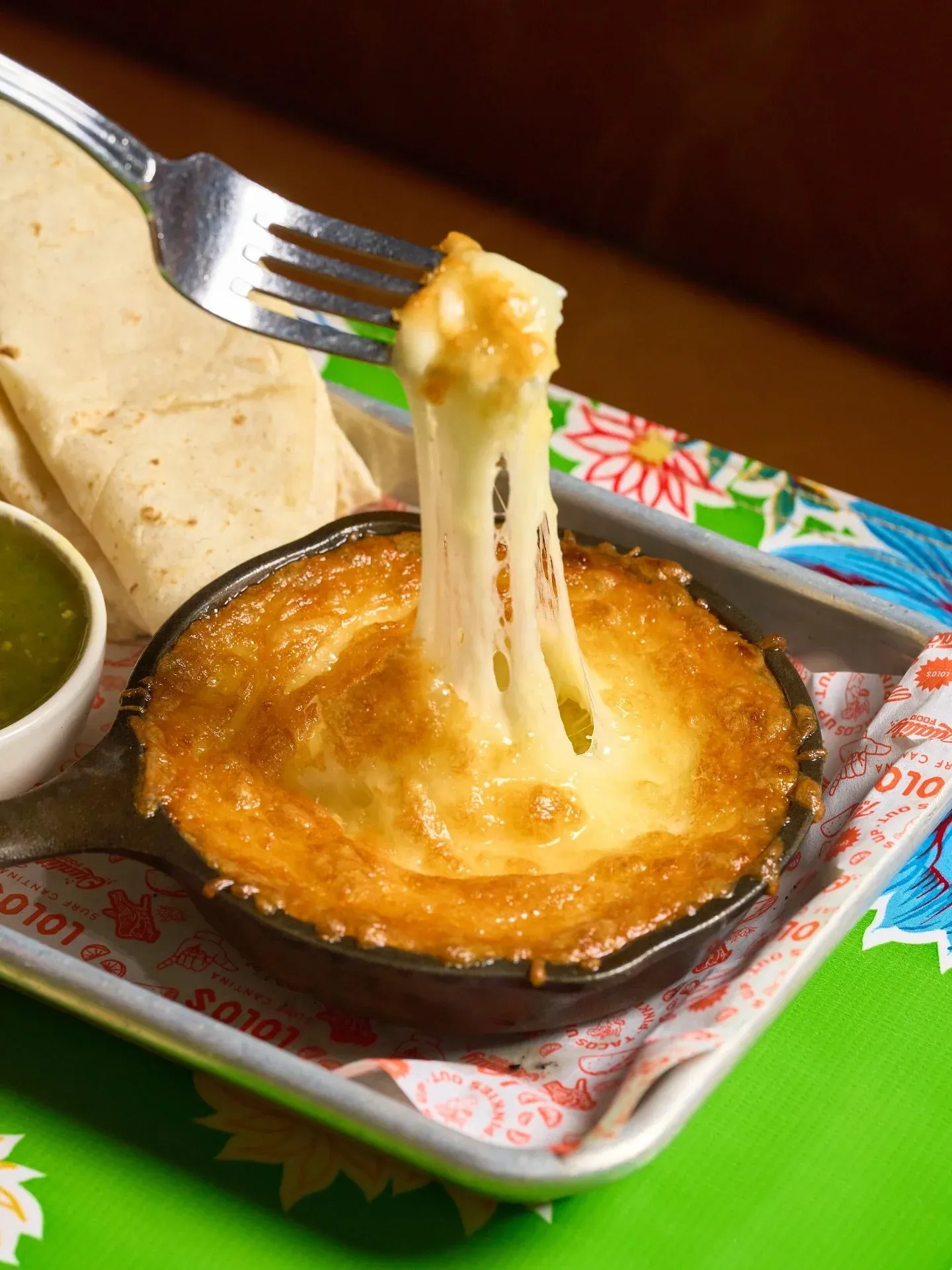 Savor every cheesy bite of our Queso Fundido on National Cheese Day 🧀

Chihuahua cheese, cheddar, roasted Anaheim chiles, warm tortillas, and salsa verde. Will you keep it classic or add chorizo? 🔥
