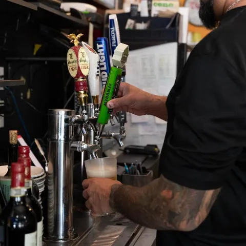 Pouring a beer on tap