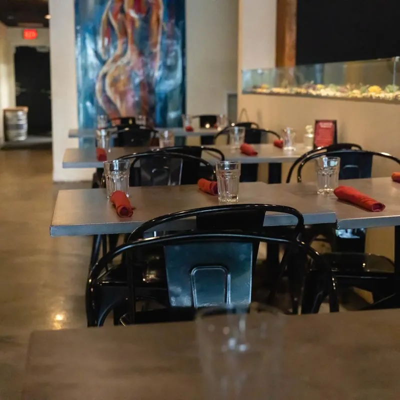 Seating area, tables ready for guests.
