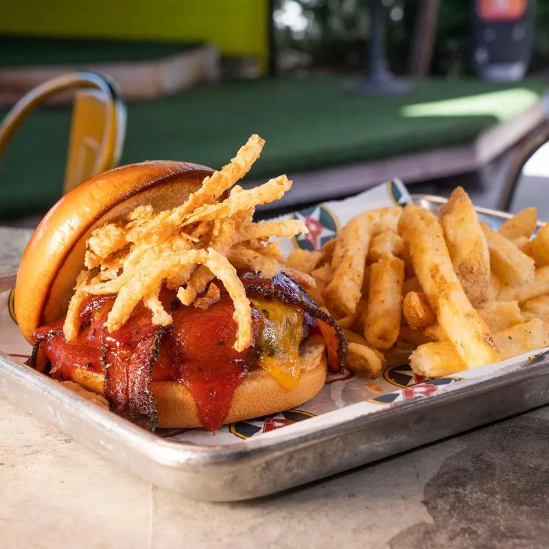 Cheeseburger, with bacon, BBQ sauce, crispy onion straws and fries