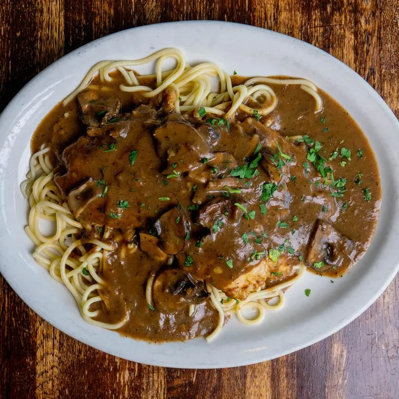 Veal pasta dish with mushrooms in a Marsala wine sauce.