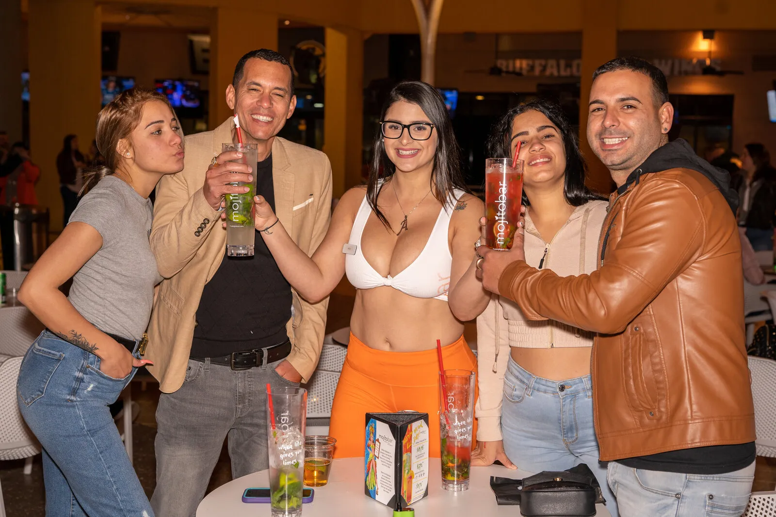 Guests toasting with mojitos