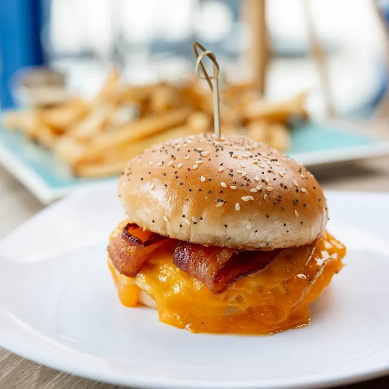 Breakfast sandwich, with bacon, cheese, and eggs.