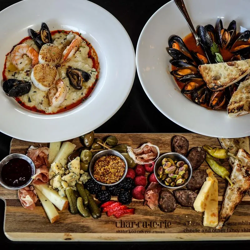Charcuterie board and seafood plates.