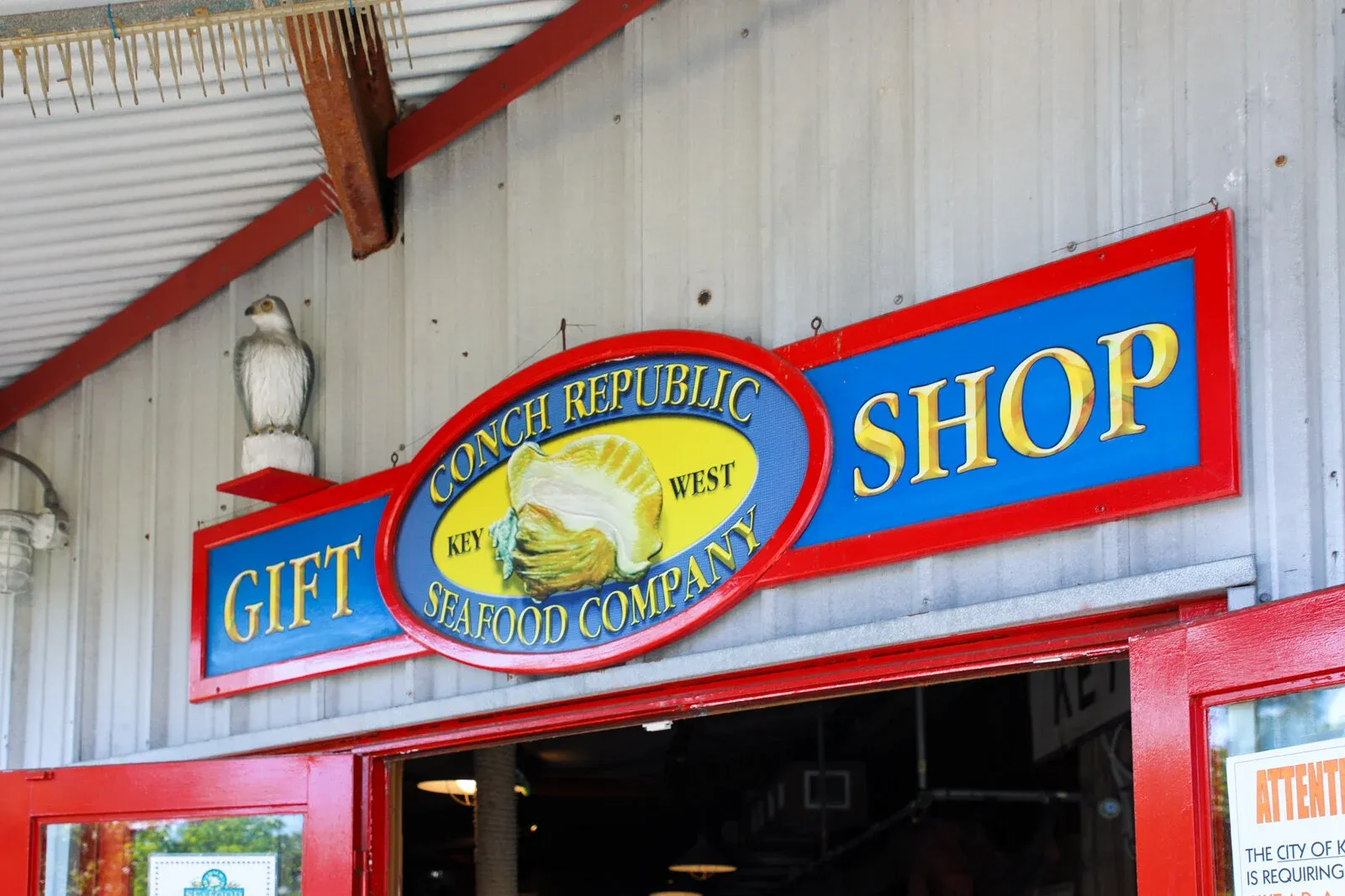 Exterior of a seafood restaurant gift shop with a colorful sign above the entrance