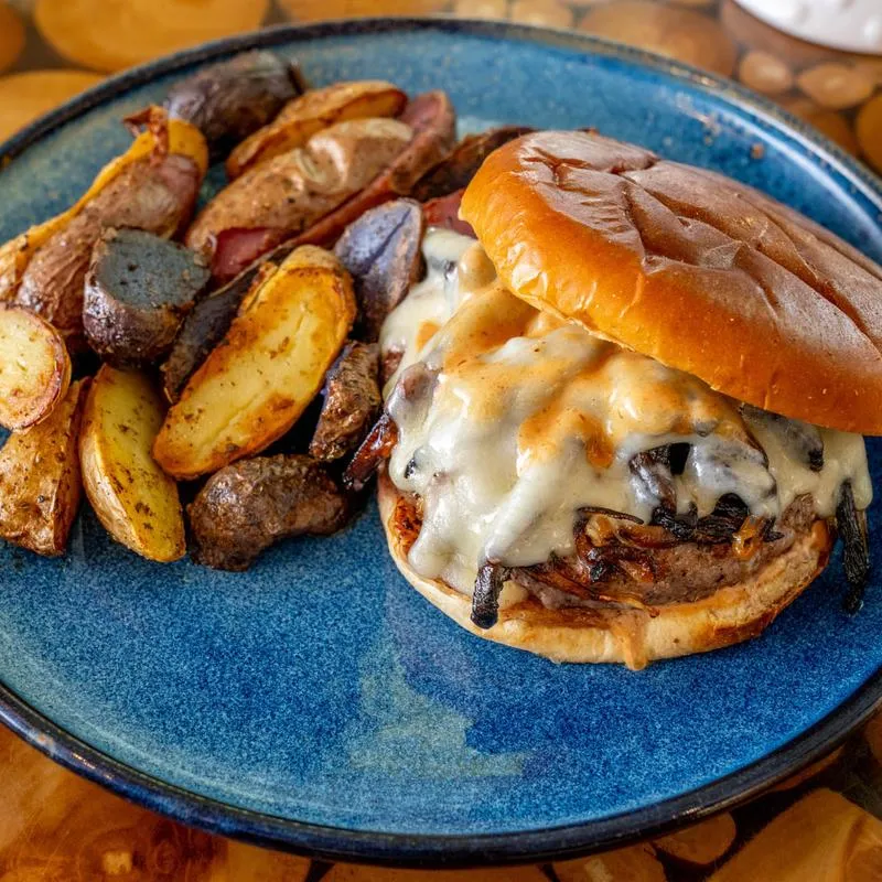 Smokehouse Wagyu Burger served with tri-color fingerlings.