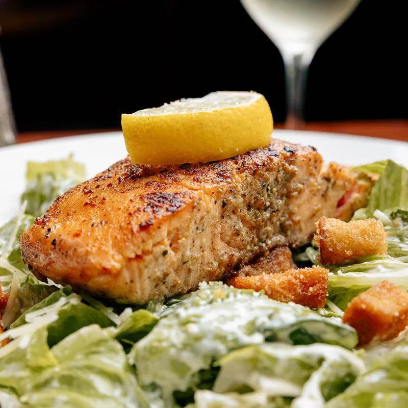 Caesar salad with grilled salmon