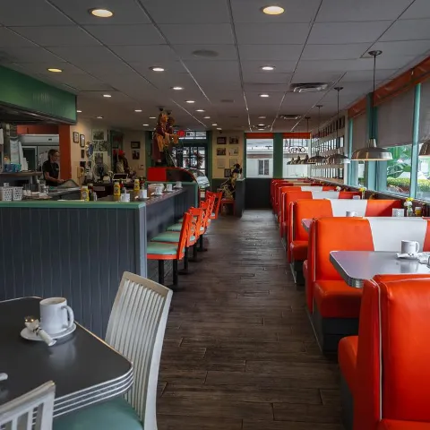 The restaurant's interior, tables and chairs.