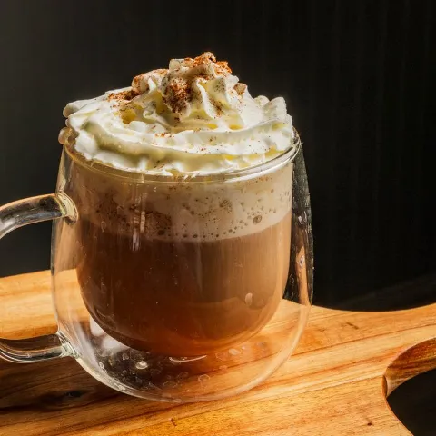 Cappuccino in a glass cup.