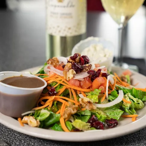 Salad dish with cheese on side