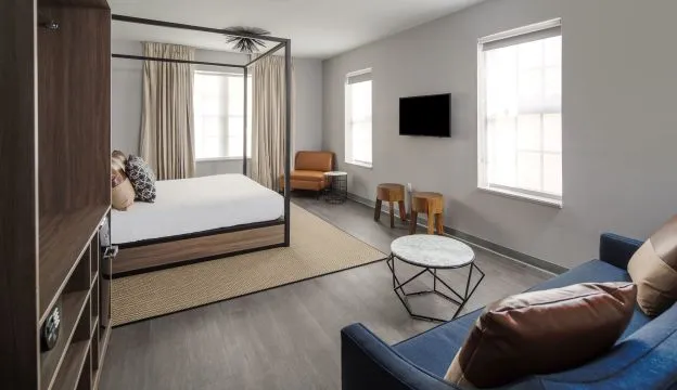 A Room With A Bed And Couches