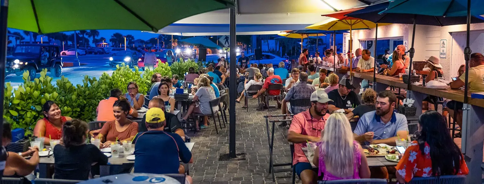 People eating in the outdoor patio dining area