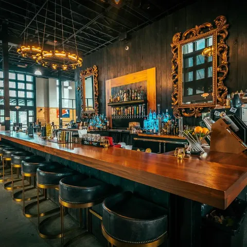 Bar Area - bar stools neatly lined up along the counter