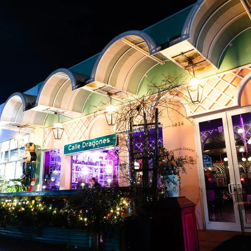 Restaurant exterior at night with illuminated facade.