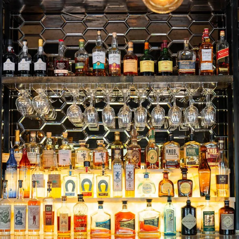 Shelves with stacked bottles.