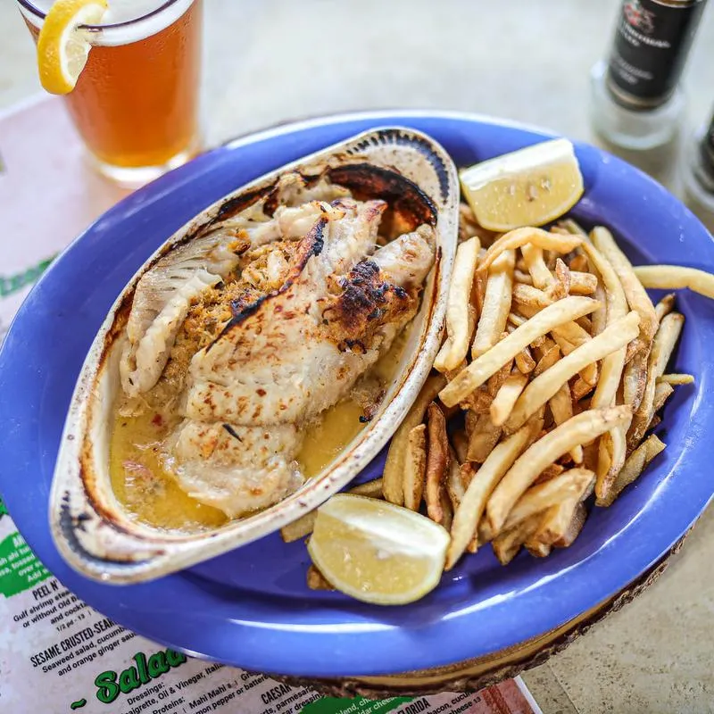 Grouper with crab cake stuffing in garlic butter sauce, with fries