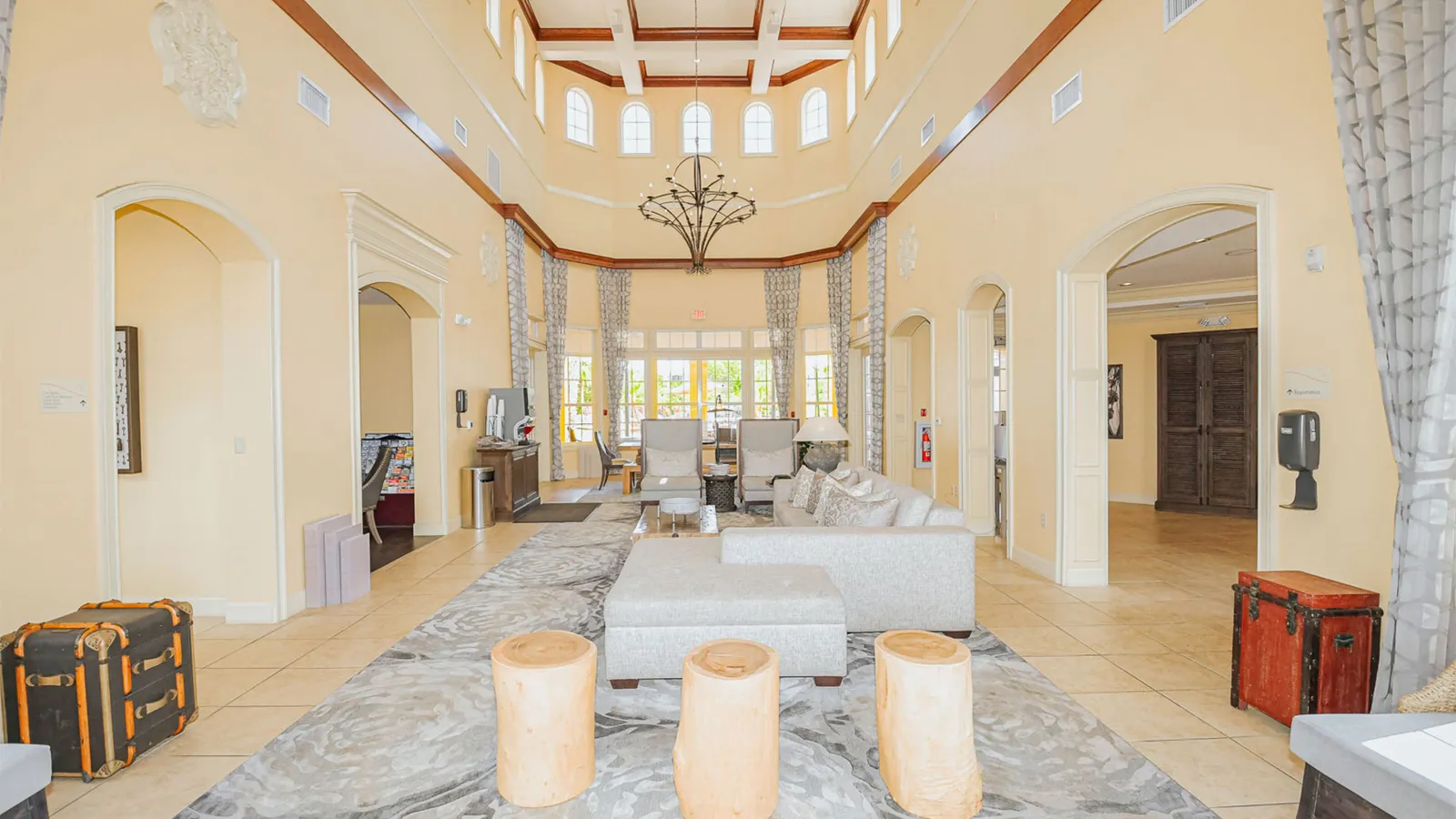 a large living room with a chandelier and a couch