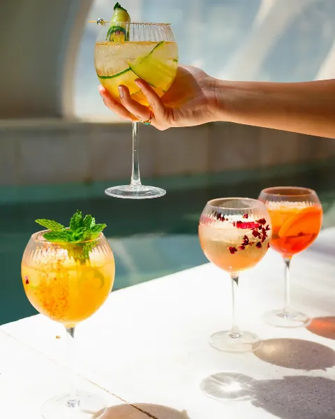 Three-panel collage featuring refreshing cocktails by the pool